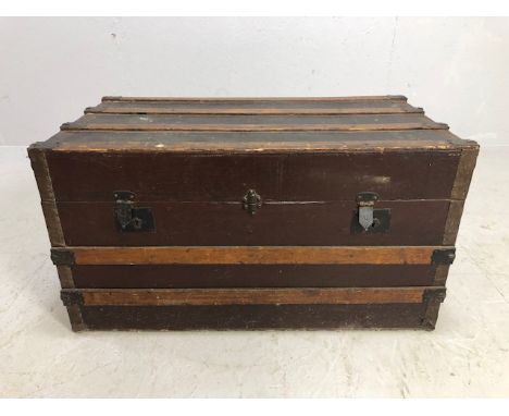 Antique Victorian travel trunk of cloth covered wood, with wood and metal banding, leather side handles, inner tray, approxim