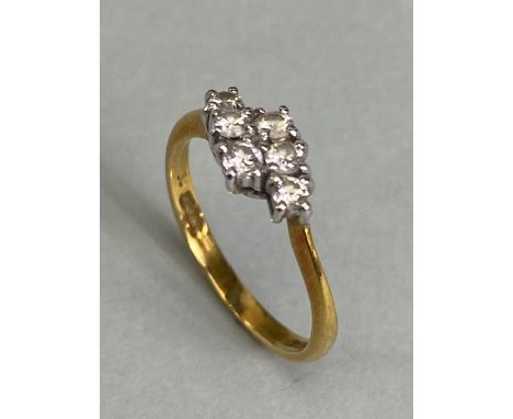 18ct yellow gold ring with a cross over setting containing 6 diamonds approximately 2.2g size K
