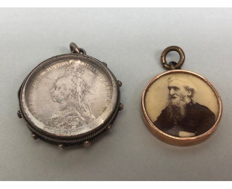 Queen Victoria silver shilling 1887 shield back in a silver glass pendant case, and a rose gold  metal mounted salvation Army