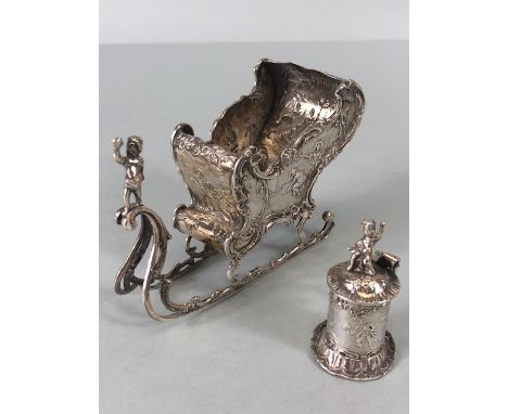 Antique novelty continental silver sledge (table salt) decorated in Rococo style, with people and scrolls, along with a conti