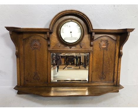 Arts and Crafts wall mounted hall mirror in large carved frame with shelf under, carved decoration & a barometer and thermome