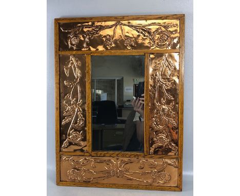 Arts & Crafts mirror of four hammered Copper plate panel design in light oak frame approx 48 x 63cm
