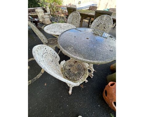 Garden furniture, 2 round cast metal tea tables of similar design and 4 cast metal chairs 