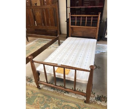Antique Furniture, single bed frame, light oak, of Arts and Crafts design, foot and head boards with tapered spindles, with m