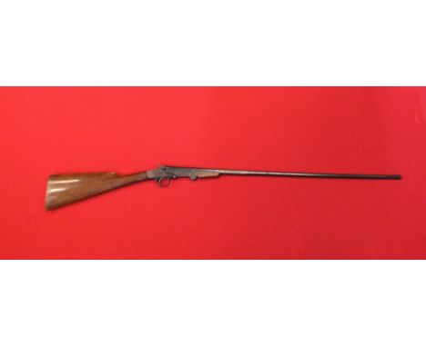 A .410 S/B folding shotgun.  Sidelever opening with central hammer s/no.798 marked on top Flat Modern Arms Co. Ltd, London an