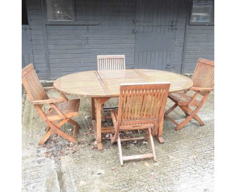 A teak extending garden table, 118 x 180cm overall, together with a set of four matching folding garden chairs, with cushions