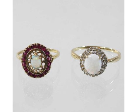 A 9 carat gold opal cluster ring, boxed, 4.8g, size W, together with another, set with a white opal, 3.7g, size Z3 (2)Larger 