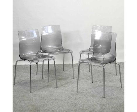 A set of four Italian perspex dining chairs, on metal legs (4)Condition report: All solid and usable. The seats and frames ar