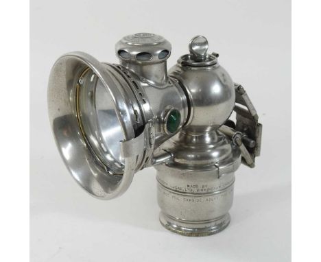 An early 20th century Joseph Lucas nickel cased bicycle lamp, with a clear lens, inscribed Calia Toura 153, Joseph Lucas Ltd,