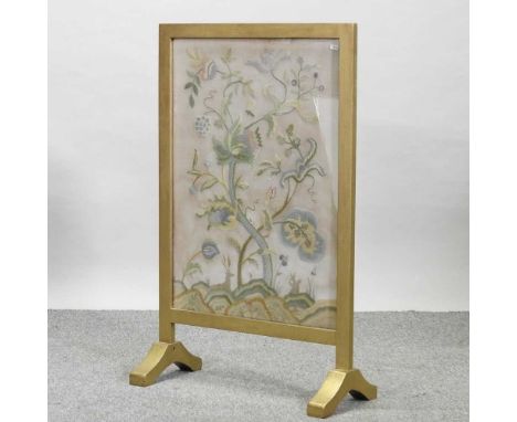 An early 20th century tapestry firescreen, with a gold painted frame
