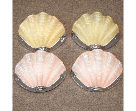 A pair of Art Deco pink glass wall lights, each in the form of a shell, in a chrome mount, together with a pair of amber glas
