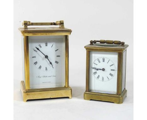 A 20th century German brass cased carriage clock, the white enamel dial signed Aug. Schatz and Sons, 14cm high, together with