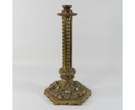 A large and ornate brass lamp base, decorated in relief with foliage and flowers47cm highCondition report: Very heavy and wel