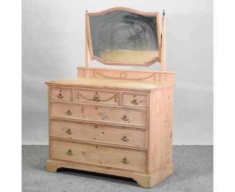 An Edwardian stripped pine dressing chest, with an adjustable mirror, on bracket feet107w x 54d x 150h cmCondition report: So