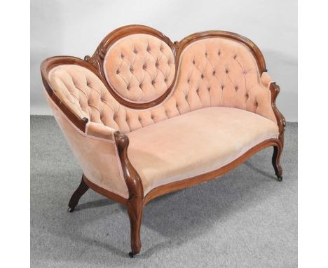 A Victorian mahogany and peach upholstered sofa, with a shaped button back, on cabriole legs154w x 65d x 90h cmCondition repo