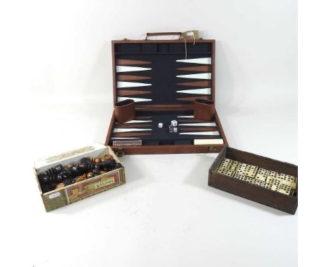 A backgammon case, together with a chess set and dominoes