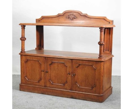 A Victorian light oak buffet, with a gallery back, and three panelled doors below134w x 51d x 110h cm