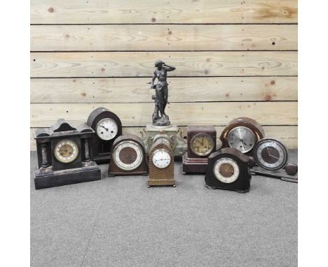 An early 20th century brass cased mantel clock, of lancet shape, with a simulated basketweave case, 22cm high, together with 