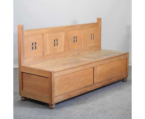 A hand made light oak box settle, 20th century, with a panelled back and rising seat183w x 60d x 102h cm