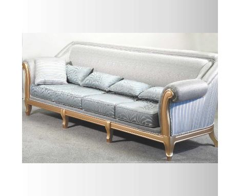 A large gilt framed and pale blue upholstered sofa280w x 82d x 96h cm