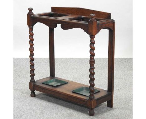 An early 20th century oak stick stand67w x 27d x 76h cmCondition report: Solid and usable, but dirty with light marks and sig