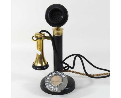 An early 20th century brass mounted stick telephone, with a bakelite top32cm highCondition report: Quite a lot of surface mar