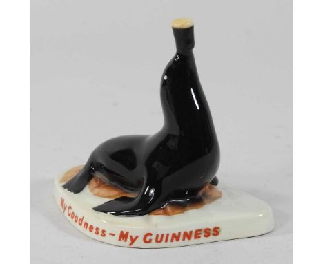 A Carltonware Guinness advertising model of a seal, balancing a pint of Guinness, inscribed My Goodness - My Guinness, red pr