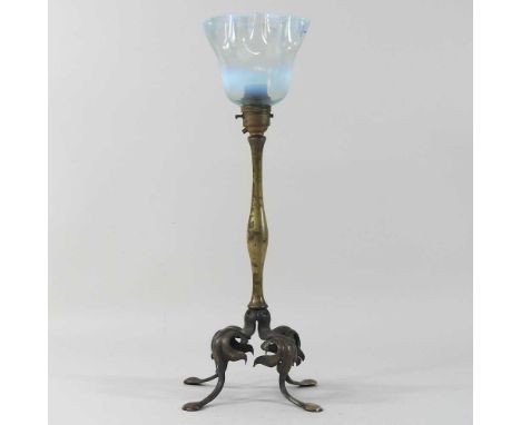 An early 20th century brass Arts and Crafts lamp, in the manner of WAS Benson, with a frilled opalescent shade40cm highCondit