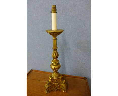 A rococo style giltwood table lamp