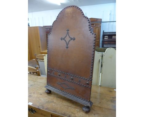 A French oak and leather firescreen