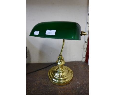 A brass students desk lamp