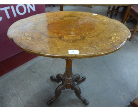 A Victorian inlaid walnut tripod table