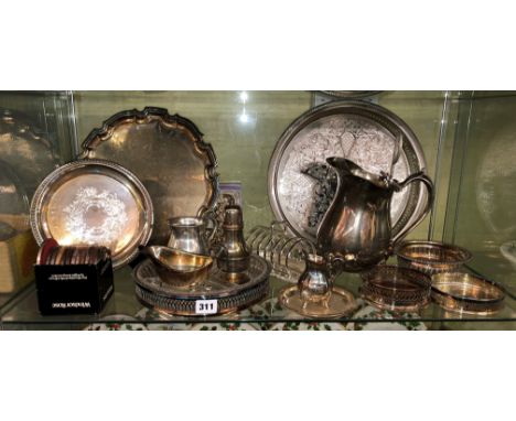 SHELF OF EPNS WARES INCLUDING SALVERS, SAUCEBOATS, BOTTLE COASTERS, TOAST RACK, PLACEMATS, ETC