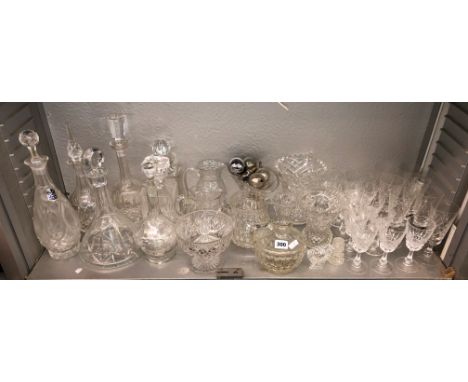 SHELF OF CUT GLASS MALLET AND SHIP'S DECANTERS, WATER JUGS AND DRINKING GLASSES