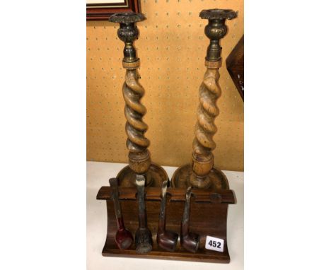 PAIR OF BARLEY TWIST CANDLE STICKS AND A PIPE RACK OF PIPES 