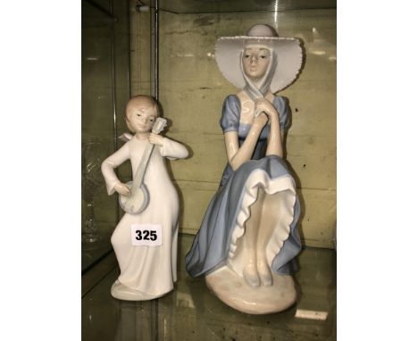 NAO FIGURE OF A SEATED GIRL IN A BONNET AND AN ANGEL