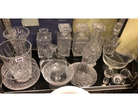 SHELF OF CUT GLASS DECANTERS, TAPERED VASES, BOWLS