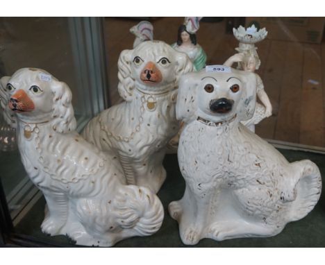 A group of three late 19th Century or later Staffordshire spaniels modelled with gilt padlock and clasps together with a furt
