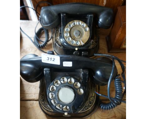 Two vintage gilt and black metal Bell telephones.