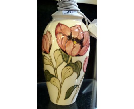 A large Moorcroft magnolia pattern lamp based upon a cream ground. 