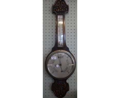 A mid 20th Century oak banjo barometer.