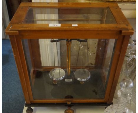 A cased set of balance scales.