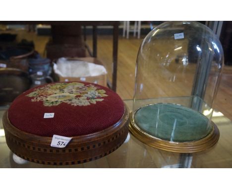 A Victorian inlaid mahogany footstool with three ceramic bun feet together with a Victorian glass dome.