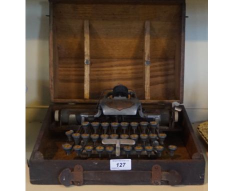 A vintage Vlickensderfer of America typewriter, fitted in original wooden case.