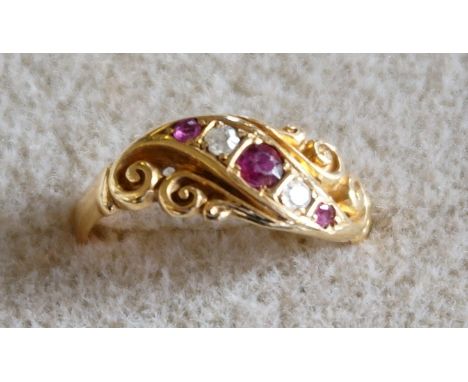 An Edwardian yellow gold, diamond and ruby ring, total weight approx 2.1gms.