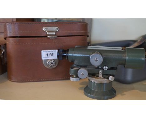 A vintage theodolite, together with silver-plated flatware.