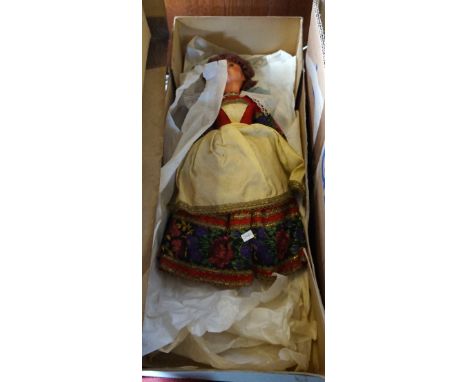 A vintage French doll fitted in original box with original clothing.