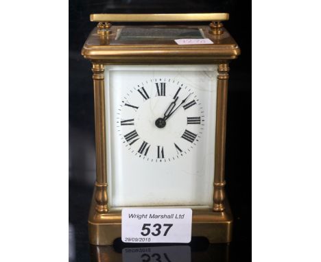 A French brass bound rectangular carriage clock, with enamel dial.