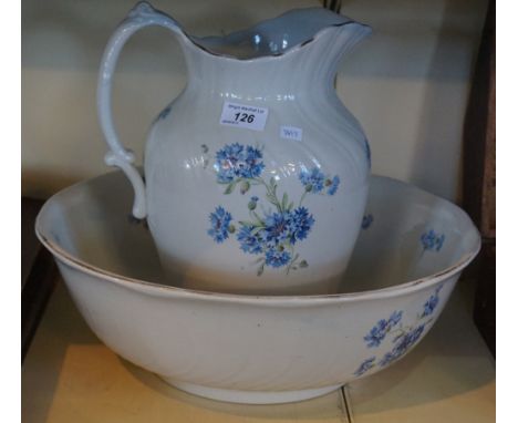A vintage floral decorated jug and bowl set.