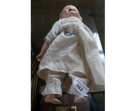 An unusual ceramic three-faced doll, with various expressions.